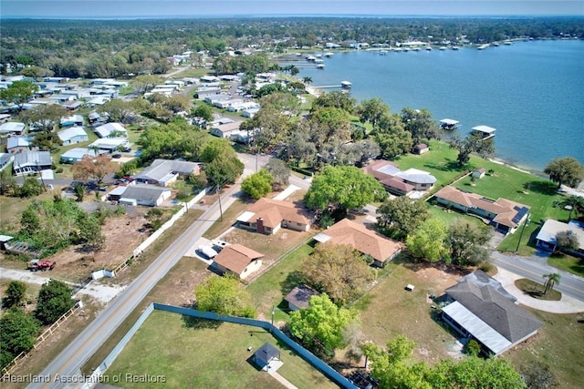 drone / aerial view featuring a water view and a residential view