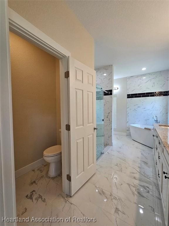 full bath with a freestanding tub, vanity, toilet, a shower stall, and marble finish floor