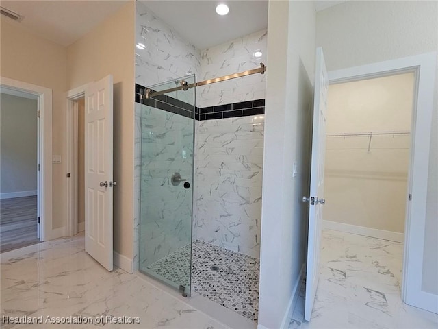 bathroom with recessed lighting, a marble finish shower, a walk in closet, visible vents, and marble finish floor