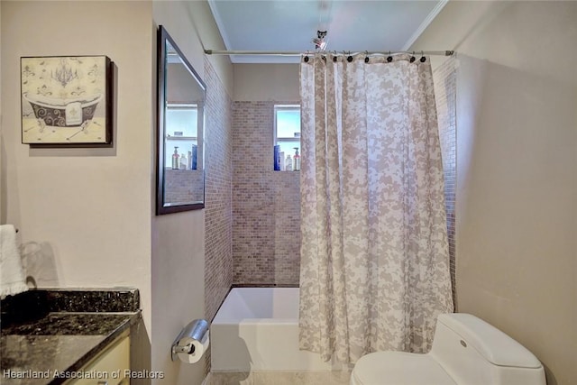 bathroom with crown molding, shower / tub combo with curtain, vanity, and toilet