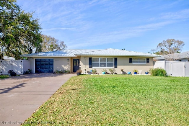 ranch-style home featuring an attached garage, driveway, a front lawn, and stucco siding