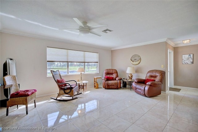 living area with ornamental molding, visible vents, baseboards, and a ceiling fan