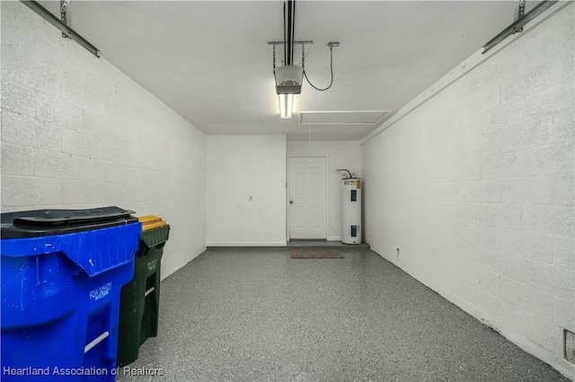 garage with electric water heater and a garage door opener