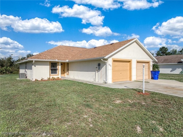 single story home with a garage, a front yard, and central AC