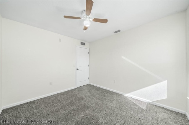 carpeted empty room featuring ceiling fan