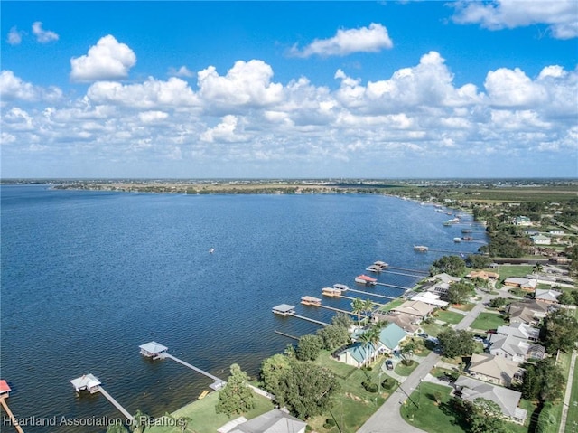 birds eye view of property with a water view