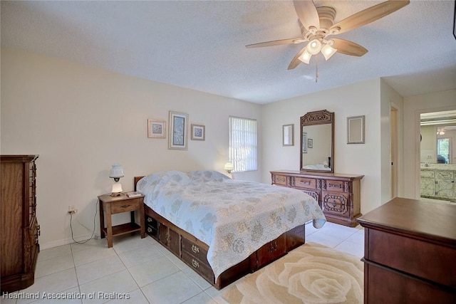 bedroom featuring multiple windows, a textured ceiling, and light tile patterned flooring