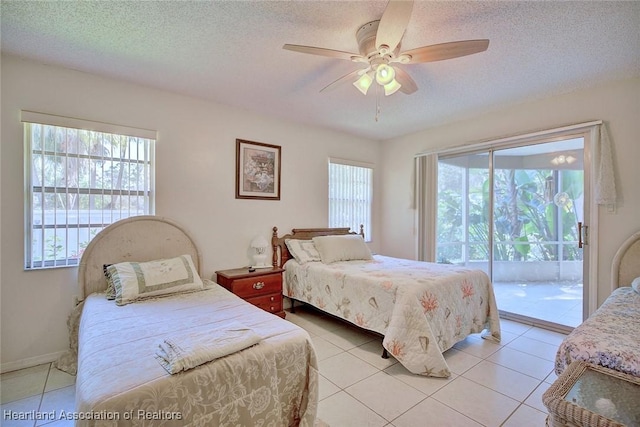 bedroom with a textured ceiling, access to outside, light tile patterned floors, and ceiling fan