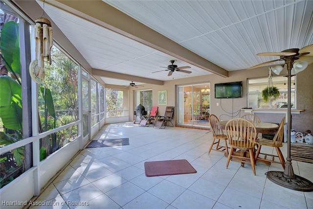 sunroom with beam ceiling