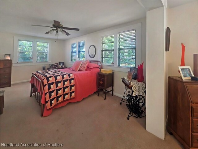 21 N French Ave, Fort Meade, FL 33841 - bedroom with carpet flooring, baseboards, and a ceiling fan