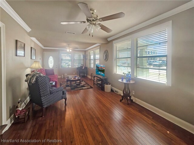 21 N French Ave, Fort Meade, FL 33841 - living area featuring hardwood / wood-style flooring, crown molding, a ceiling fan, and baseboards