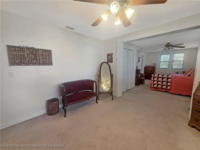21 N French Ave, Fort Meade, FL 33841 - sitting room featuring a ceiling fan, carpet floors, and baseboards