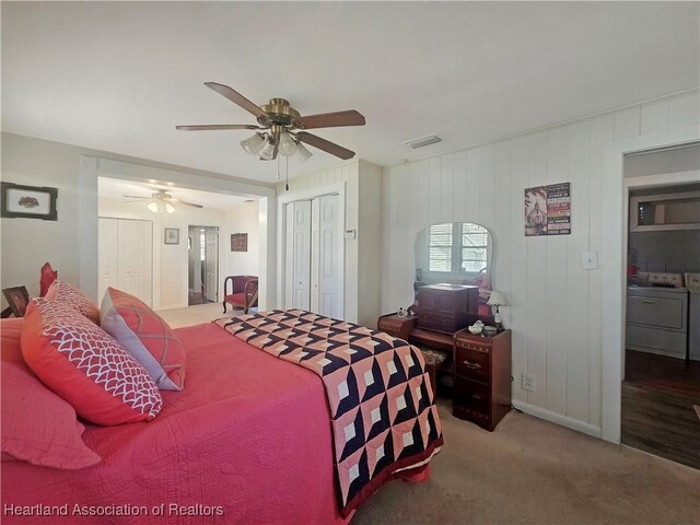 21 N French Ave, Fort Meade, FL 33841 - bedroom featuring washer and dryer, carpet flooring, multiple closets, and a ceiling fan