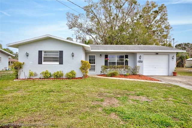 ranch-style home with a garage and a front yard