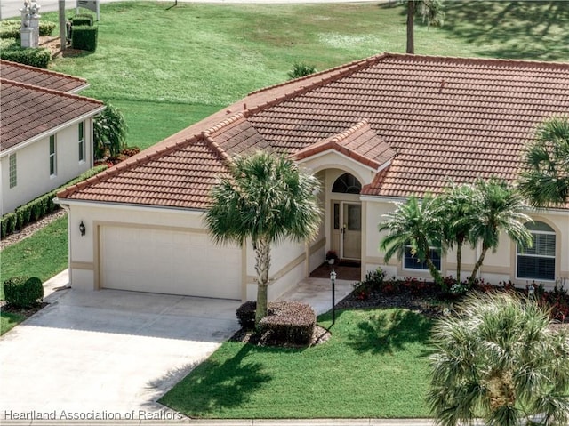 view of front facade with a front yard and a garage