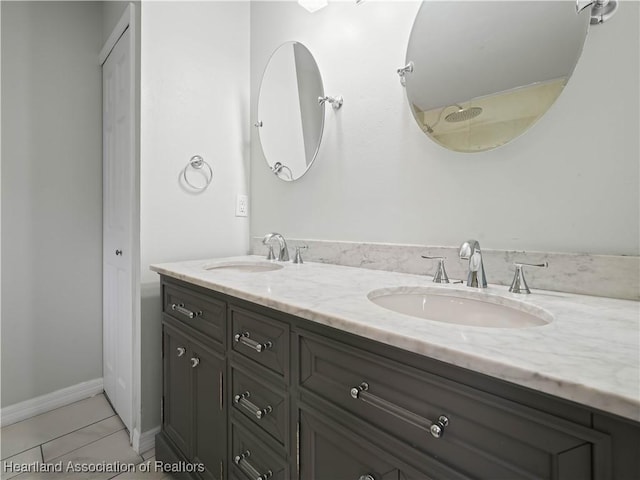 bathroom with vanity and tile patterned floors