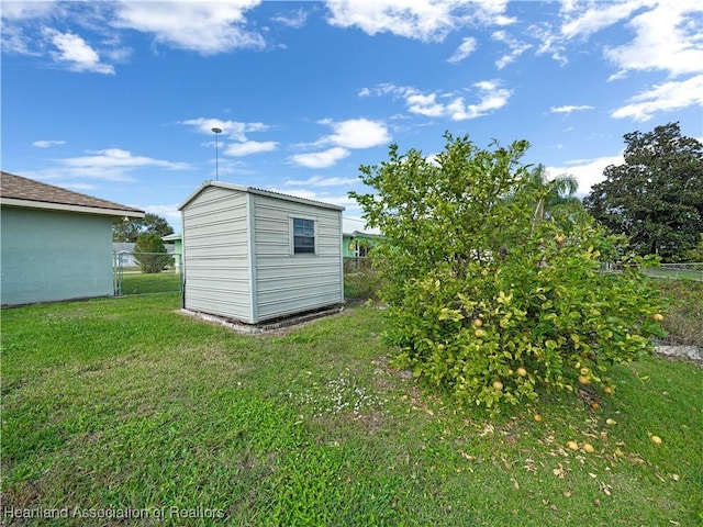 view of outbuilding featuring a lawn