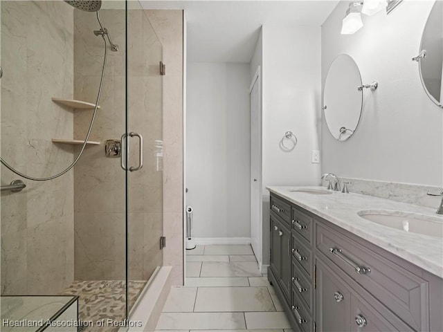 bathroom featuring vanity and a shower with shower door