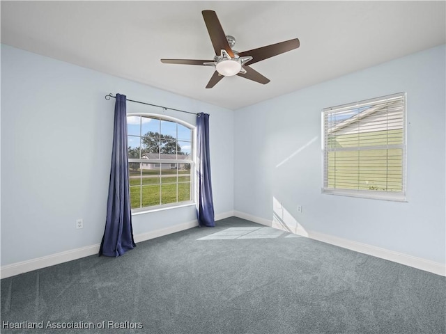 unfurnished room with ceiling fan and carpet floors