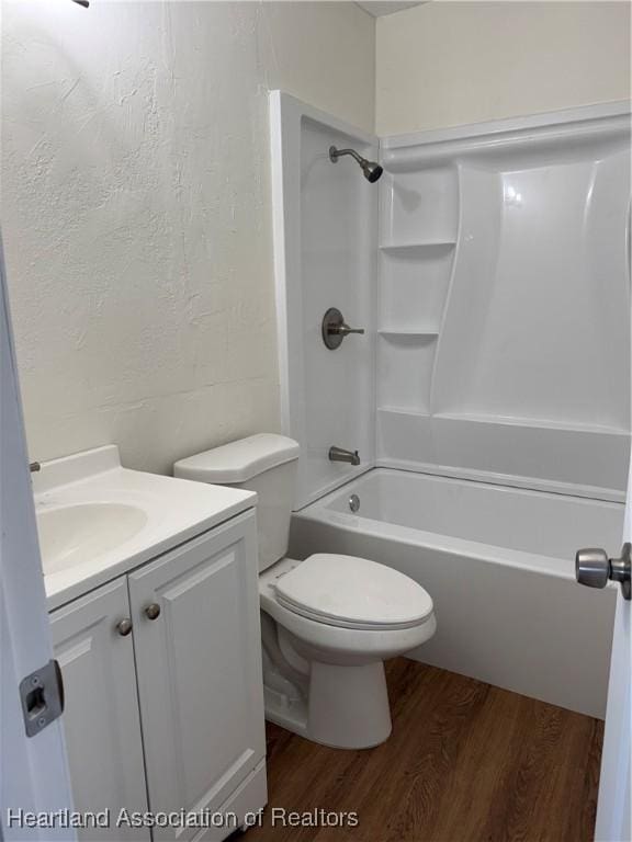 4504 High Ave, Sebring, FL 33870 - bathroom with wood finished floors, vanity, toilet, and shower / bath combination