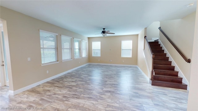5406 Fishhawk Dr, Lithia, FL 33547 - unfurnished living room featuring stairway, baseboards, and a ceiling fan