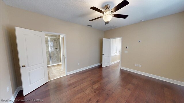5406 Fishhawk Dr, Lithia, FL 33547 - unfurnished bedroom featuring baseboards, visible vents, ceiling fan, and dark wood-type flooring