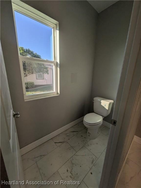 bathroom featuring toilet