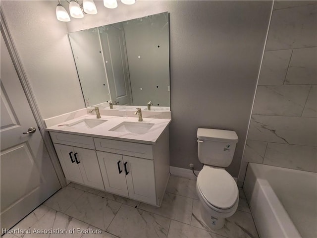 bathroom with toilet and vanity