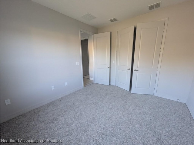 unfurnished bedroom featuring carpet floors