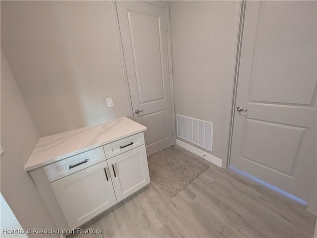 bathroom featuring hardwood / wood-style floors and vanity