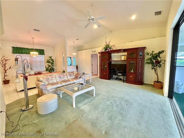 living room featuring carpet floors, vaulted ceiling, and ceiling fan