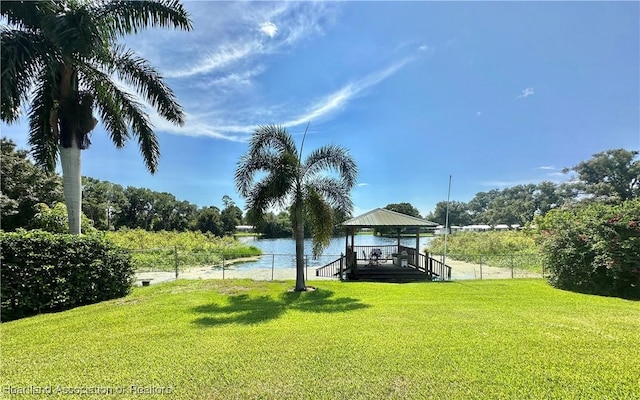 view of yard with a gazebo and a water view