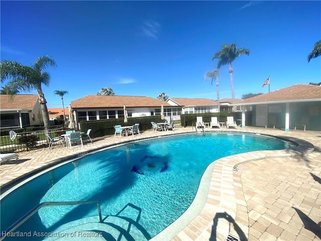 view of swimming pool featuring a patio area