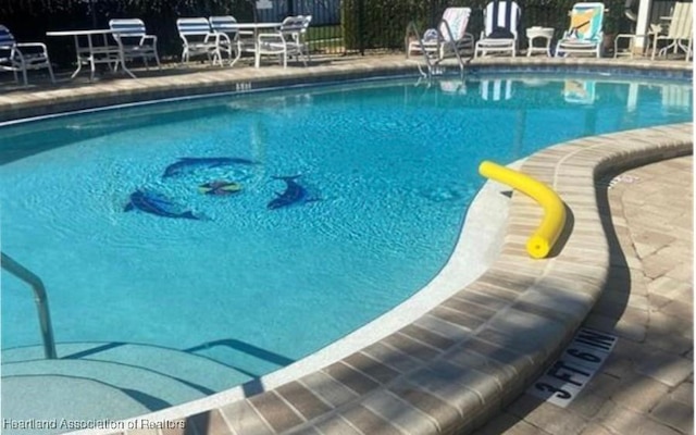 community pool with fence