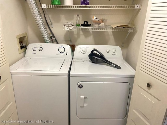 washroom featuring laundry area and independent washer and dryer