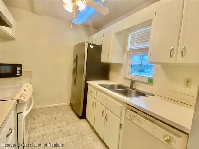 kitchen with ceiling fan, sink, white cabinets, and white appliances