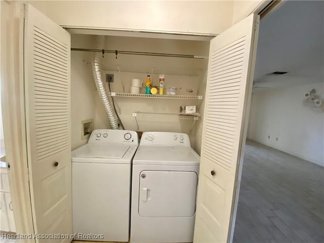 laundry room with laundry area, visible vents, and washer and dryer