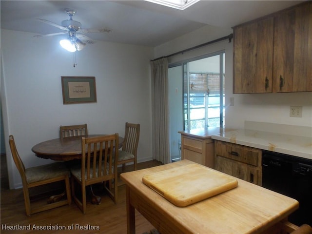 dining room featuring ceiling fan and wood-type flooring