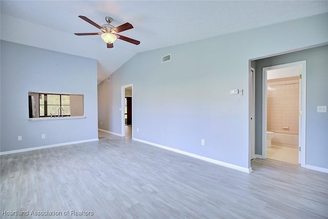 6518 Matanzas Dr, Sebring, FL 33872 - spare room with a ceiling fan, baseboards, wood finished floors, and vaulted ceiling