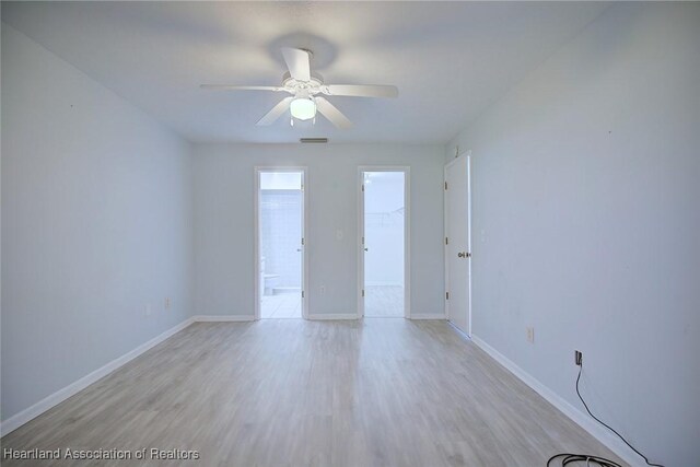 6518 Matanzas Dr, Sebring, FL 33872 - empty room with light wood-type flooring, baseboards, and ceiling fan