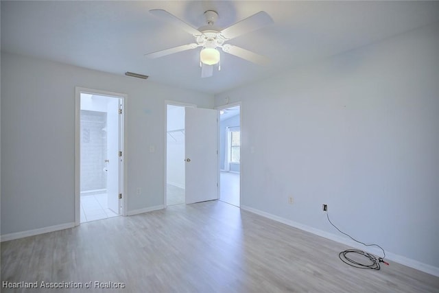 6518 Matanzas Dr, Sebring, FL 33872 - unfurnished bedroom featuring wood finished floors, baseboards, and ceiling fan