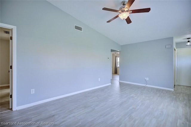 6518 Matanzas Dr, Sebring, FL 33872 - unfurnished room featuring a ceiling fan, high vaulted ceiling, wood finished floors, and baseboards