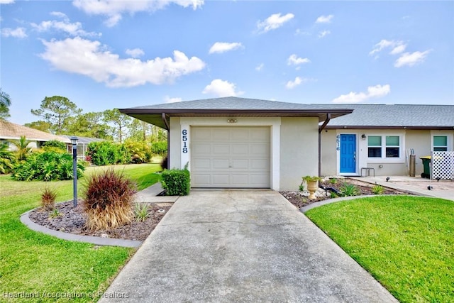 6518 Matanzas Dr, Sebring, FL 33872 - view of front facade with an attached garage, stucco siding, a front lawn, and driveway
