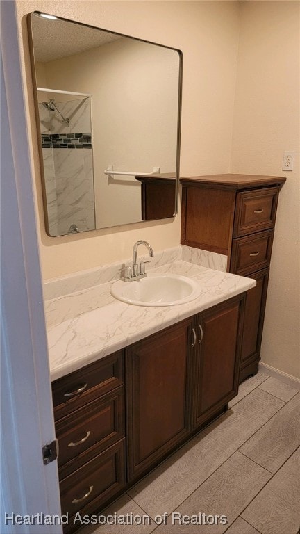 bathroom with vanity and walk in shower