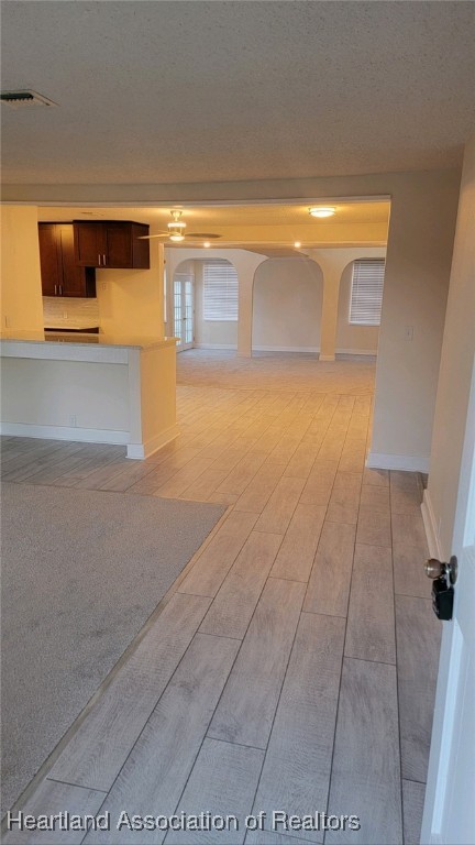 unfurnished room featuring a textured ceiling