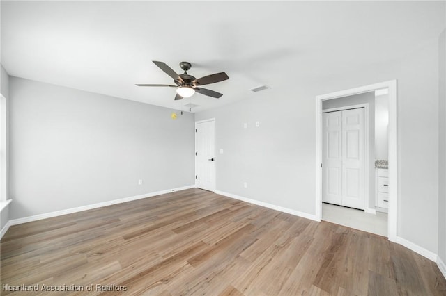 4225 Cooper Dr, Sebring, FL 33872 - unfurnished bedroom featuring light wood-style flooring and ceiling fan