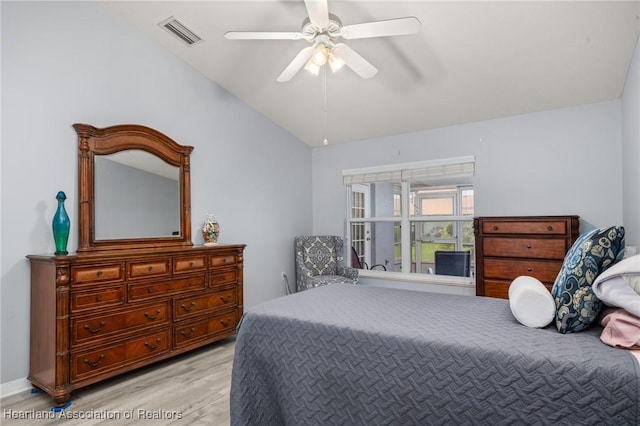 3730 Camry Ct, Sebring, FL 33872 - bedroom featuring vaulted ceiling, wood finished floors, and ceiling fan