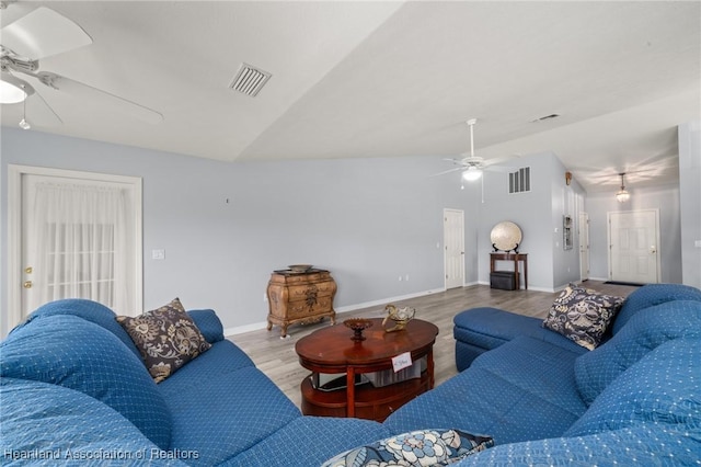 3730 Camry Ct, Sebring, FL 33872 - living area featuring ceiling fan, wood finished floors, and vaulted ceiling