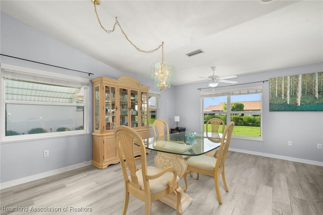 3730 Camry Ct, Sebring, FL 33872 - dining area with a chandelier, light wood-type flooring, and ceiling fan
