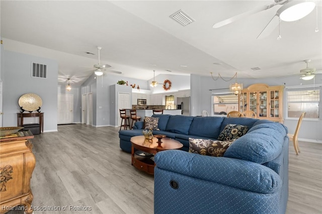 3730 Camry Ct, Sebring, FL 33872 - living room with ceiling fan, vaulted ceiling, and light wood-style floors